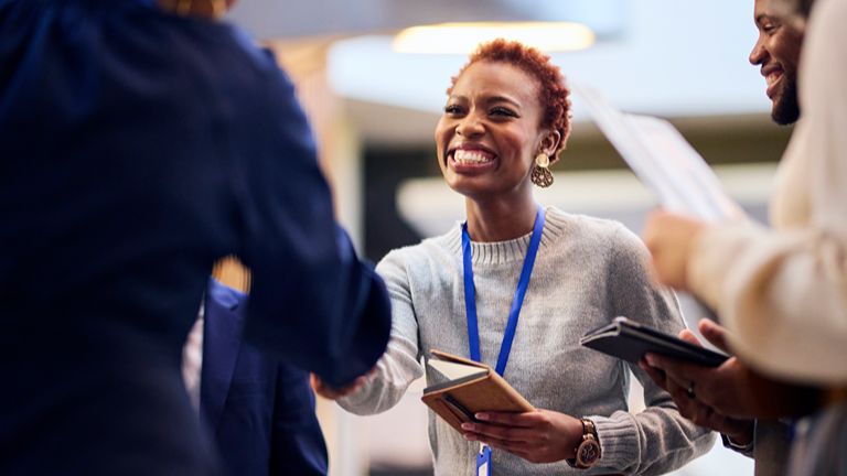 Woman networking at a business conference event